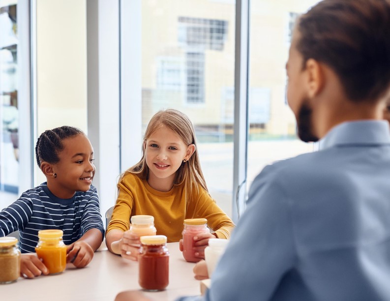 Generations kids testing sauce in focus group with moderator